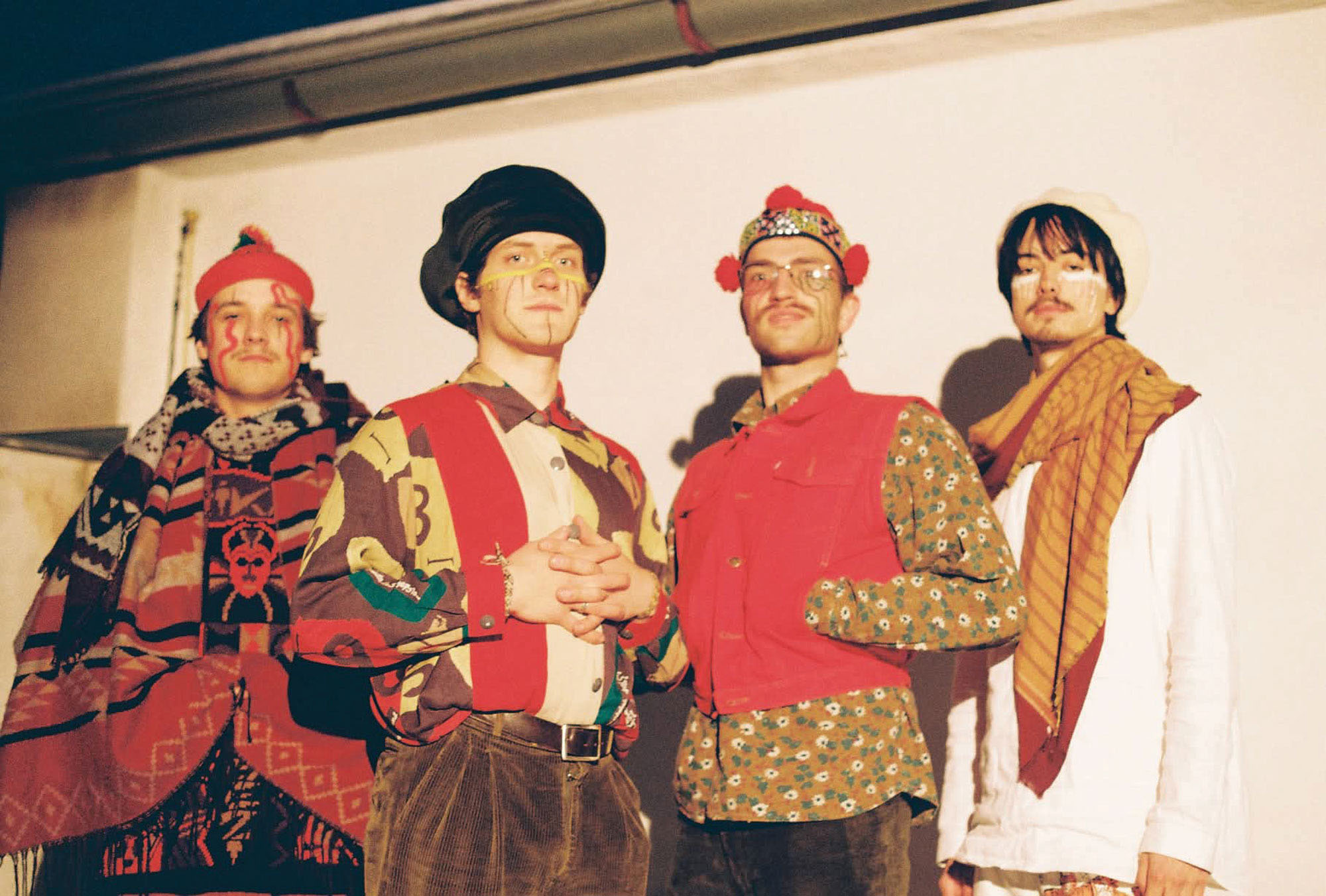 Four men in traditional dress