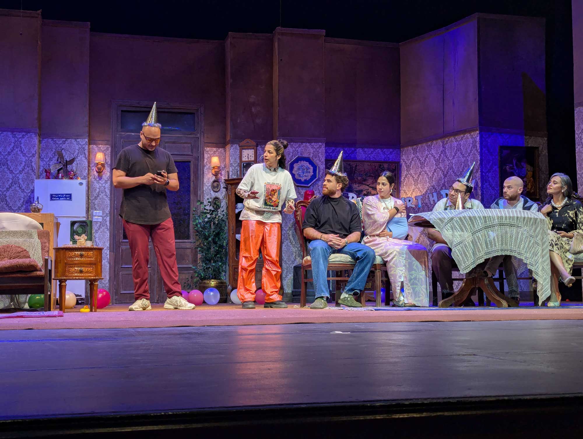 People on stage performing a play