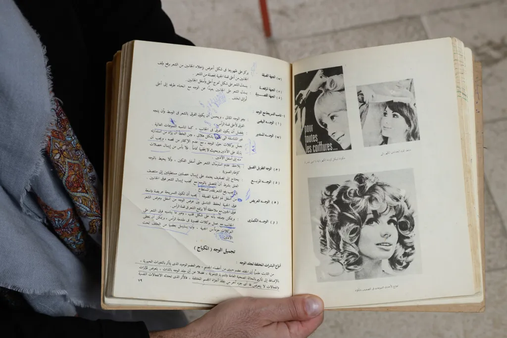 open book being held by a hand