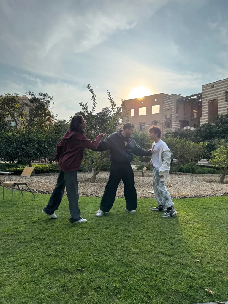 people fighting in the AUC garden in a scene from one of the plays