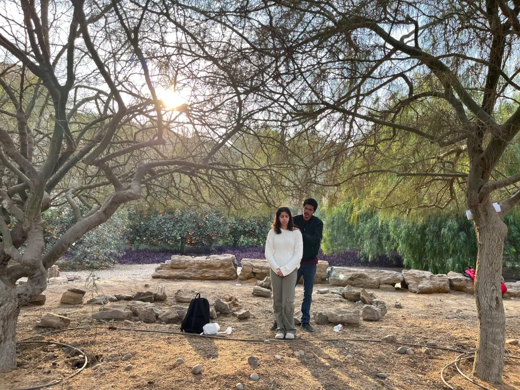 people in the AUC garden in a scene from one of the plays
